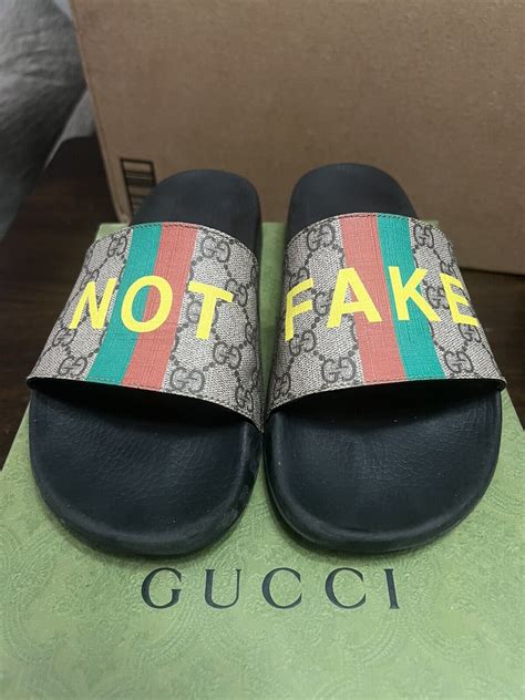 gucci supreme slides fake